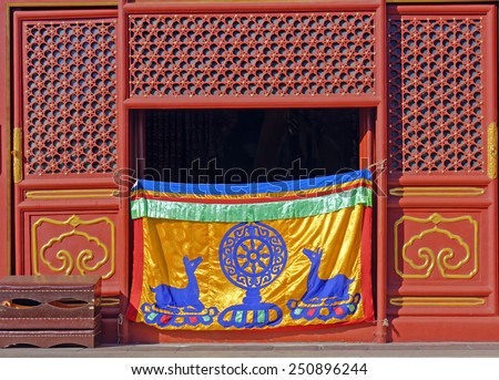Dharma wheel and deer symbols of the Buddhist faith at Falun Hall,Yonghe (Lama) Temple in Beijing, China