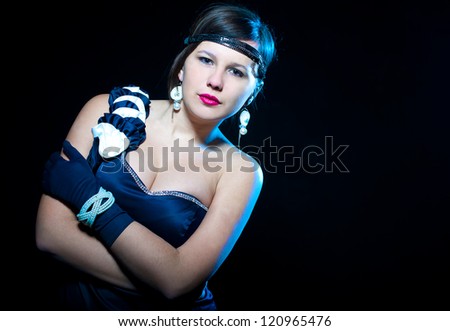 Brunette lady in glove isolated on black