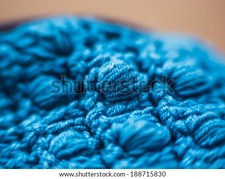 Knitted fabric - macro of a blue woolen texture