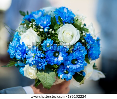 wedding bouquet from white and blue flowers