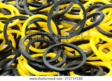 Closeup or many yellow and black elastic band or plastic band