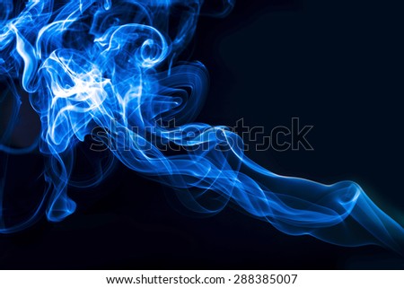 Blue smoke moving from lower right angle to upper left angle, abstract background