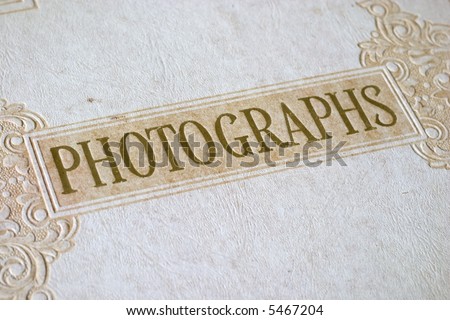 Vintage photo album, word PHOTOGRAPHS large in center
