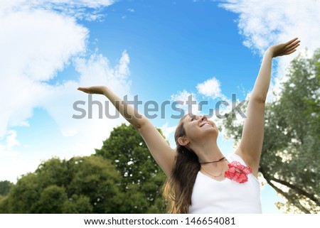 girl pulls hands to the sky