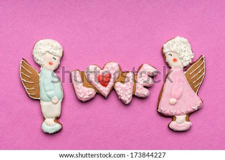 Cookies with the text of love and couple of angels on Valentine's day