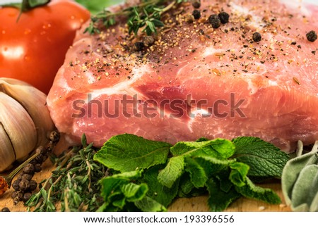 Food. Raw Meat for barbecue with fresh Vegetables and Mushrooms on wooden surface. Meat Raw Steak and spices for cooking meat.