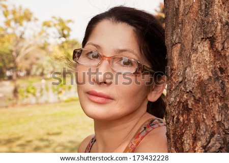 Portrait of an Asian woman aged glasses