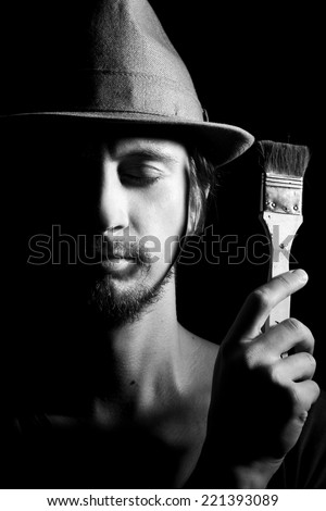 The artist with a brush, black and white photography