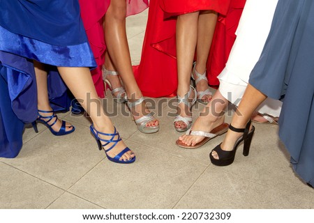 Teenage Girls showing off their shoes for the prom with just their legs and feet showing