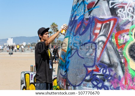 VENICE,CA-CIRCA SEPT 2010:An unidentified artist practices his art on the Venice Public Art Graffiti Walls circa Sept. 2010.The Venice Public Art Walls are managed by a local public arts organization