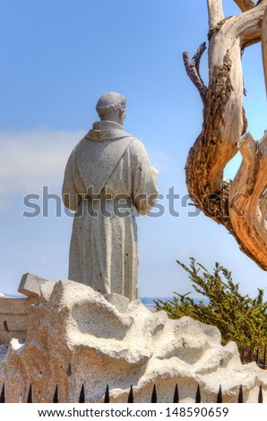 MONTEREY, CA/USA - JULY 30: Monument of Spanish friar Junipero Serra overlooking Monterey Bay at the Presidio of Monterey where Serra landed in 1770 and founded the Mission San Carlos. July 30, 2013.