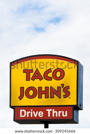 GRINNELL, IA/USA - AUGUST 8, 2015: Taco John\'s exterior and sign. Taco John\'s is fast-food restaurant featuring Mexican-inspired fast-food.