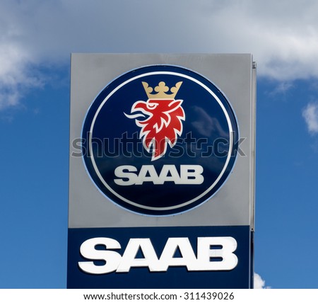 MAPLEWOOD, MN/USA - August 10, 2015: Saab Automobile sign and logo. Saab Automobile is a Swedish car manufacturer.