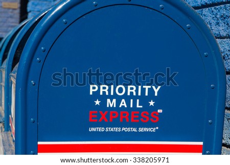 LOS ANGELES, CA/USA - NOVEMBER 8, 2015: Priority Mail Express mailbox. Priority Mail Express is a service of the United States Postal Service.