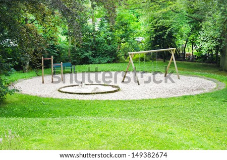 Playground with swings, climbing frame and sandpit