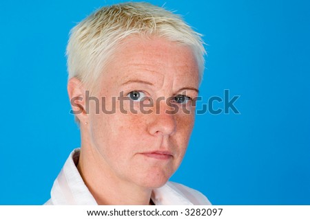 a portrait form a woman in front of a blue background