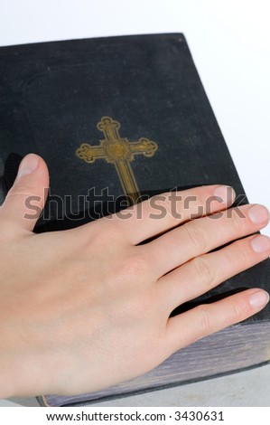 the and on the holy bible in front of a  white background