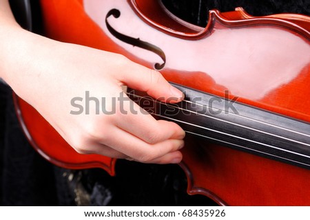 Violin playing - a close up of a violin