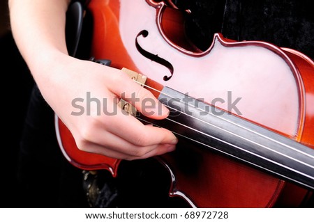 Violin playing - a close up of a violin