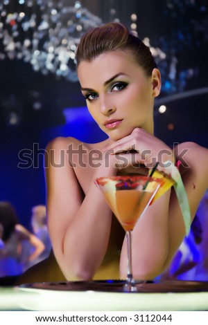 pretty woman drinking cocktail in nightclub, different kinds of lighting, shallow DOF