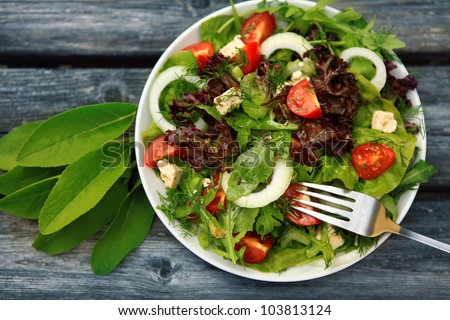 Fresh salad with tomatoes and cucumbers. green