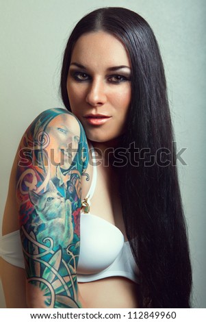 pretty young girl with tattoo. lovely woman. tattoo