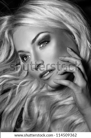 black and white portrait of young beautiful woman with long blond hair. blond