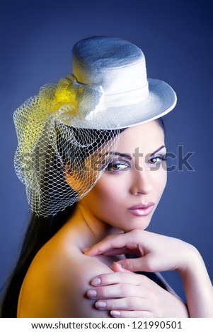 Face of young beautiful woman in a vintage hat. vintage.