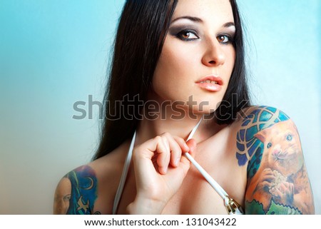 Sexy Caucasian tattooed woman. tattoo