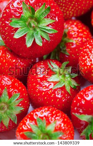 Lots of ripe perfect strawberries. Full frame background