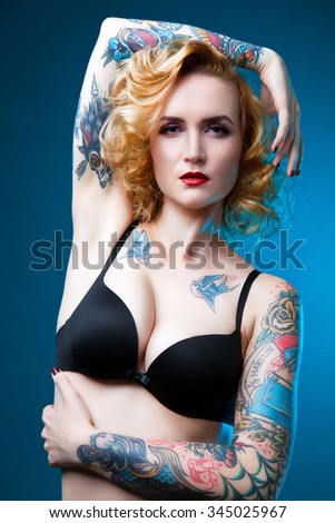 Beautiful sexy glamorous girl with tattoos. tattoo