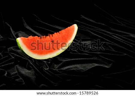 red juicy watermelon over black background