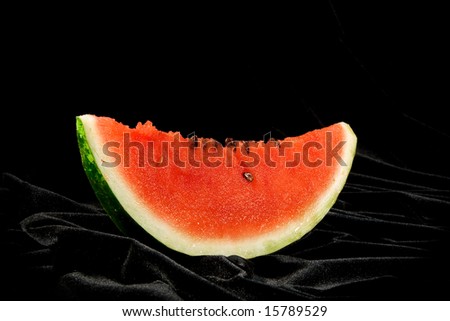red juicy watermelon over black background