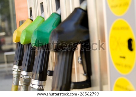 gas pump nozzles on a service station