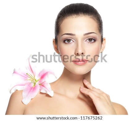 Beauty face of young woman with flower Beauty treatment concept Portrait over white background Beauty face of young woman with flower Beauty treatment concept Portrait over white background