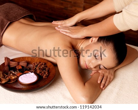 Masseur Doing Massage On Woman Body In The Spa Salon. Beauty Treatment Concept.