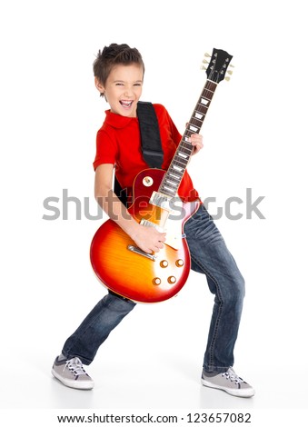 A young white boy sings and plays on the electric guitar with bright emotions, isolated on white background