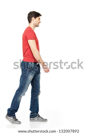 Full Portrait Of Smiling Walking Man In Red T-Shirt Casuals Isolated On White Background.
