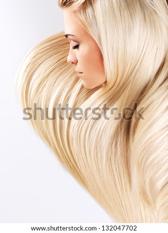 Beautiful Woman With Long Straight Blond Hairs. Fashion Model Posing At Studio.