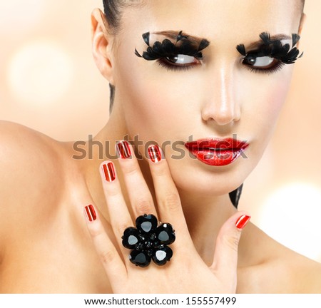Face Of Beautiful Fashion Woman With Red Sexy Lips And Black False Eyelashes At Studio
