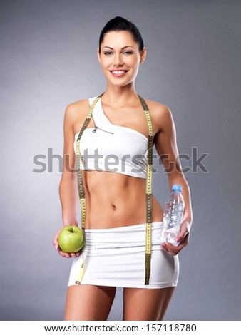 Healthy lifestyle of a happy woman with slim body after diet. Sporty female with perfect figure