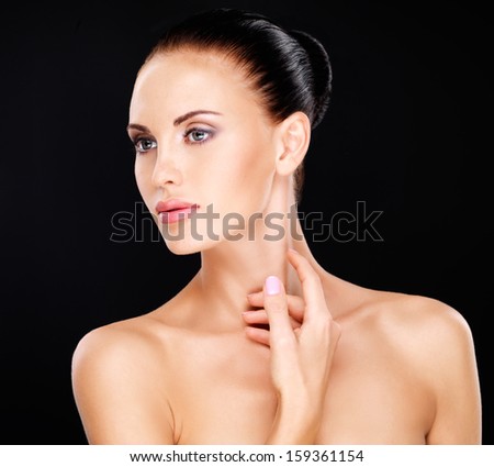 Portrait Of The Beautiful Woman Who Touches The Neck By Hands - Isolated On White