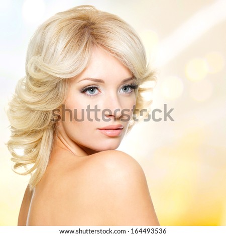 Closeup face of beautiful sensual woman with white hairs over art background