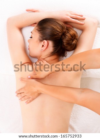 Woman having massage of body in the spa salon Beauty treatment concept Woman having massage of body in the spa salon Beauty treatment concept