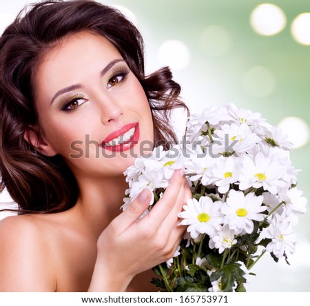 Face of beautiful woman with health skin and  flower over art background
