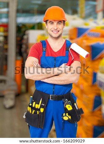 Portrait of smiling handyman at warehouse