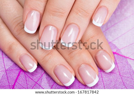Beautiful woman\'s nails with beautiful french manicure