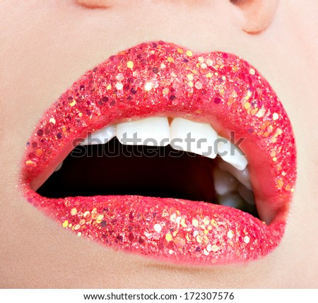 Closeup beautiful female lips with shiny red gloss lipstick