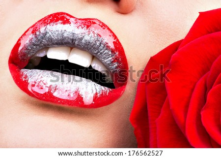 Closeup beautiful female lips with shiny red gloss lipstick and rose
