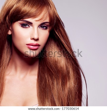 Portrait of the beautiful sexy woman with long  hair. Fashion model with straight hairstyle
